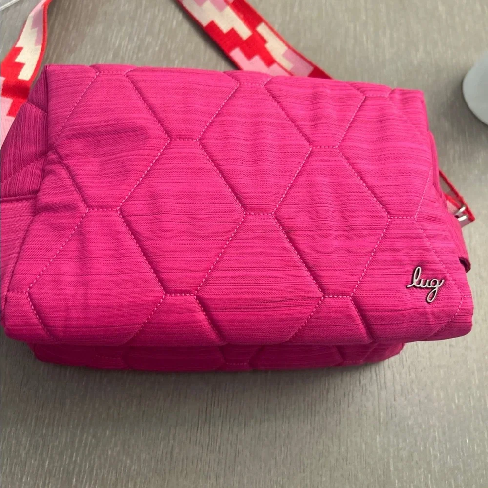 Lug Bumper purse in‎ a pink hue with a honeycomb quilting pattern